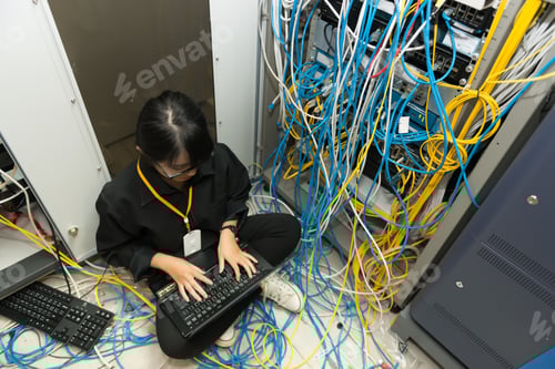 Preview: Asian Engineer Working In The Server Room,Check The Connection Problems Of Computer