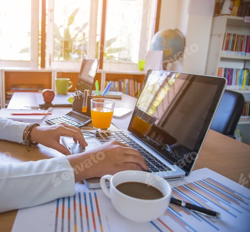 Preview: Hands Of Businessman Working On Laptop Computer With Data Charts