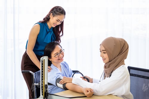 Preview: Senior Woman Patient With Relative Daughter Having Consultation With Doctor In Office Clinic