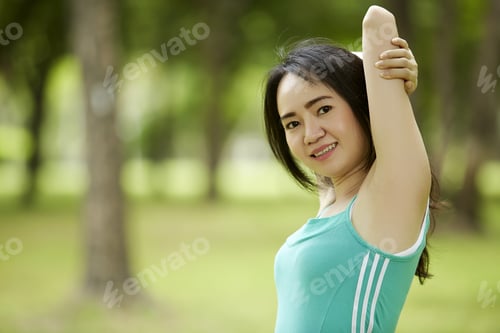 Preview: Stretching Woman In Outdoor Exercise Smiling Happy Doing Yoga Stretches After Running-Beautiful