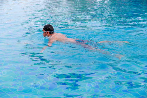 Preview: Young Man Swimmingl In A Pool