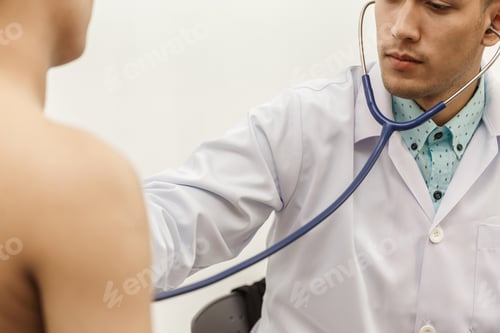 Preview: Close Up Of Doctor Listening To Patient Heartbeat With Stethoscope On Hospital. Concept Of Physical