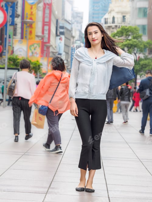 Preview: Beautiful Woman Walking On Nanjing Road In Shanghai.