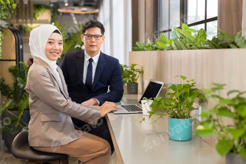 Preview: A Young Multi-Ethnic Business People Sitting Working Together.