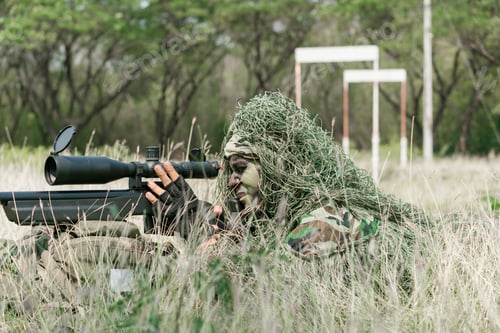 Preview: Sniper Soldier Lying On The Ground And Camouflage In Grass. Soldier Holding Gun Weapon And Waring