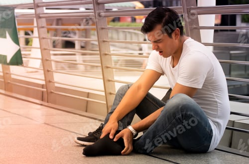 Preview: Man Experiencing Discomfort In His Ankle, Man Clutching His Ankle, Severe Heartache,Man Suffering