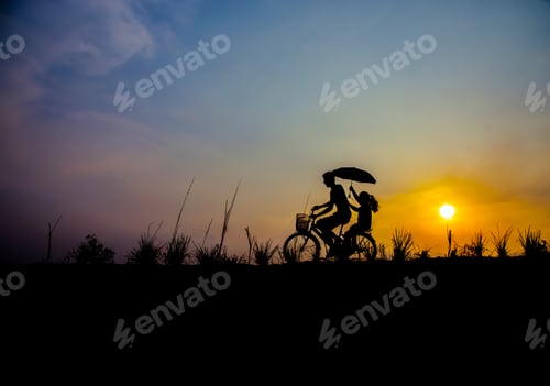 Preview: Silhouette Of Couple Driving Bike Happy Time Sunset