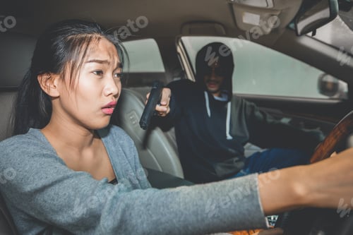 Preview: A Robber Dressed In Black Pointing A Gun At A Women Driver In A Car. Car Theft Of A Woman