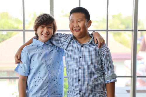 Preview: Multiethnic Smart Boys Portrait In Casual Dress With Confident And Standing In Classroom With Happy