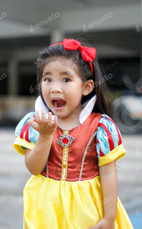 Preview: Potrait Princess Dress With Cute Asian Girl Show Hand For Hold Something