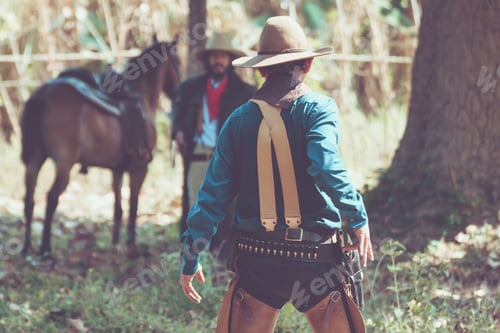 Preview: Back View Of Cowboy With Gun Prepares To Gunfight.Conwboy With Gun.