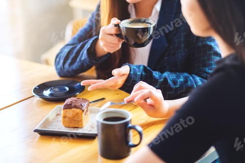 Preview: Closeup Image Of Women Enjoyed Eating Dessert And Drinking Coffee Together In Cafe