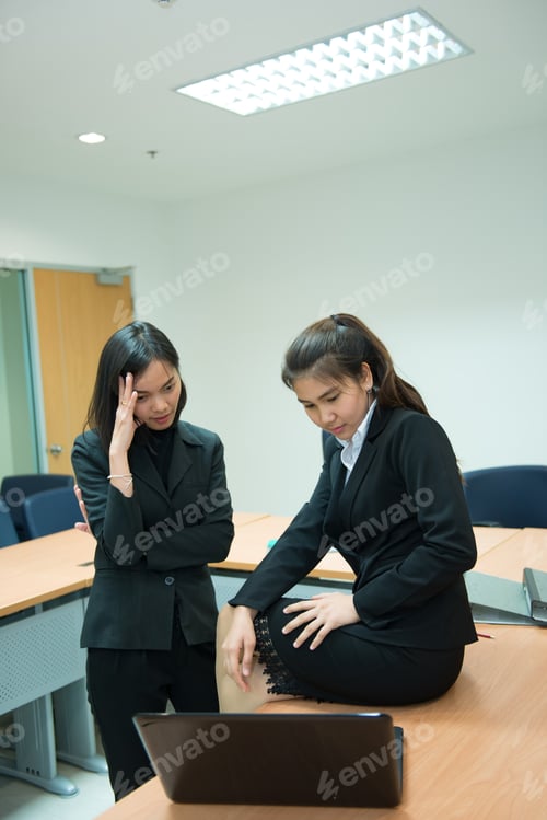 Preview: Two Business Woman Serious About Work In The Office,Discuss About Project Of Work,Thailand People