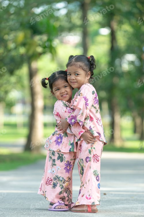 Preview: Malay Muslim Little Girls In Their Beautiful Eid Dress. Outdoor Portrait