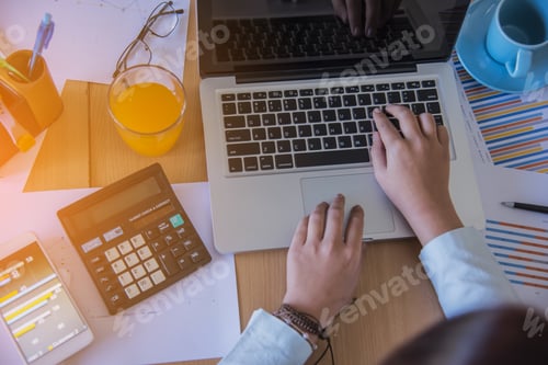 Preview: Business Man Hand Working On Smart Phone And Laptop Computer And