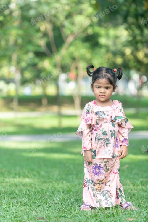 Preview: Cute Malaysian Kid In Eid Costume. Outdoor Portrait.