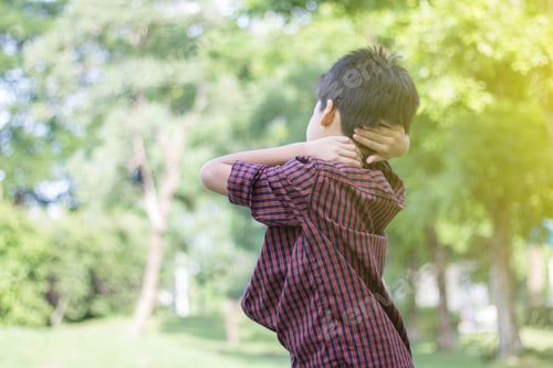 Preview: Cute Boy Twisting Exercises In The Park On Sunshine