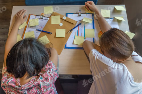 Preview: Top View Of Exhausted Women Sleeping In The Workplace