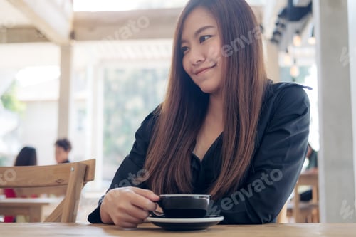 Preview: Closeup Image Of A Beautiful Asian Woman Holding And Drinking Coffee With Feeling Relaxed In Cafe