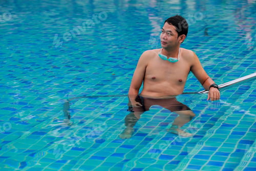 Preview: Young Man Swimmingl In A Pool
