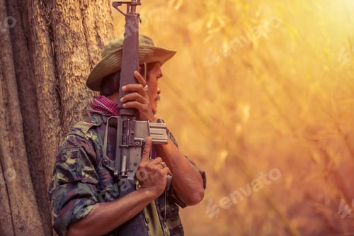 Preview: Soldier Man Put A Gun In Hands For Warrior.Army Standing In Forest .