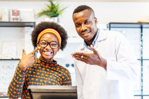 Preview: Professional Ophthalmologist Doctor African American Man Helping Young Woman African American