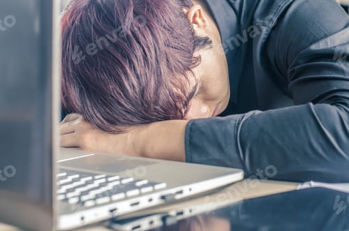 Preview: High Angle View Of Tired Businessman Sleeping While Calculating Expenses At Desk In Cafe