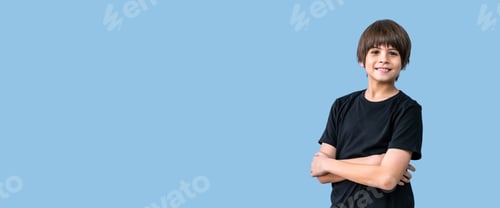 Preview: Portrait Of Cute Adorable Caucasian Boy Stands With His Arms Crossed On His Chest Wearing Black