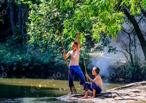 Preview: Two Boy Having Fun For Catch Fish In River.Lifestyle Of Children In Countryside Of Thailand.