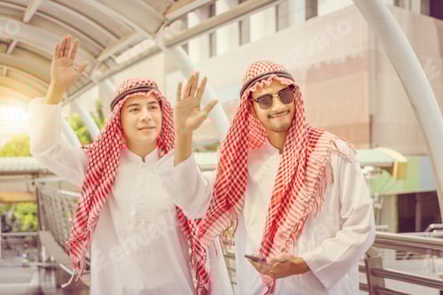 Preview: Arab Businessman Waving Greetings Hands Together At Walkway Area