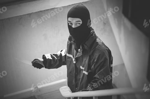 Preview: Bandit Wearing A Mask Walking On Stairs With A Knife For The Loot, Focus Is Knife