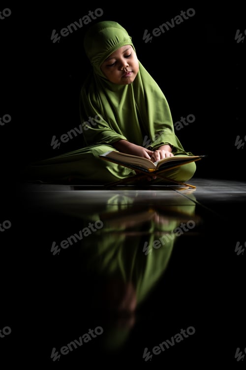 Preview: Muslim Girl Reading Quran. Black Background, Isolated