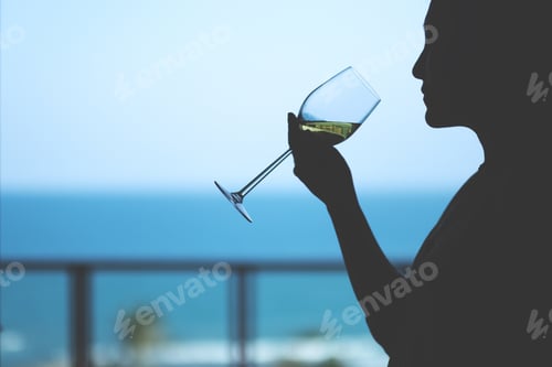 Preview: Silhouette Image Of A Woman Holding A Wine Glass To Drink With Blurred Sea Background
