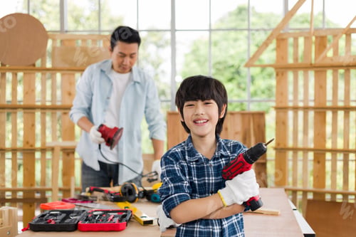 Preview: A Lovely Son Helps His Father Do Carpentry At Home.