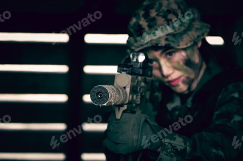 Preview: Focused Person Holding Rifle in a Dark Room
