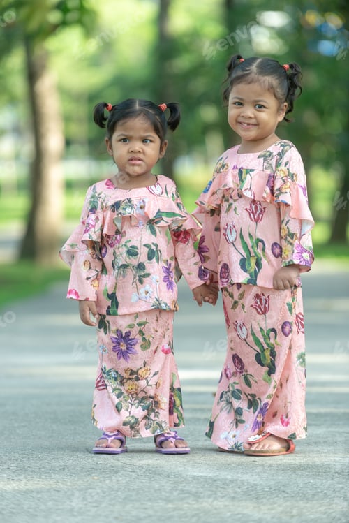 Preview: Malay Muslim Little Girls In Their Beautiful Eid Dress. Outdoor Portrait