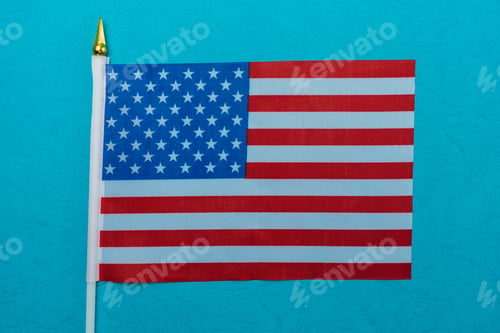 Preview: American Small Flag On Colored Paper. Abstract Background.