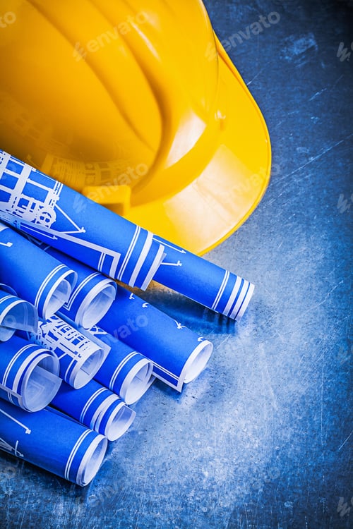 Preview: Blue Rolled Blueprints Yellow Hard Hat On Metallic Background Construction Concept.