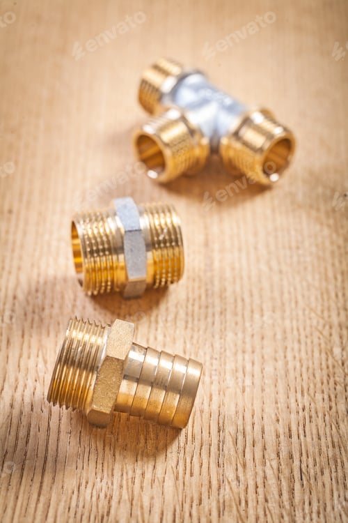 Preview: Three Plumbing Fixtures On Wooden Board