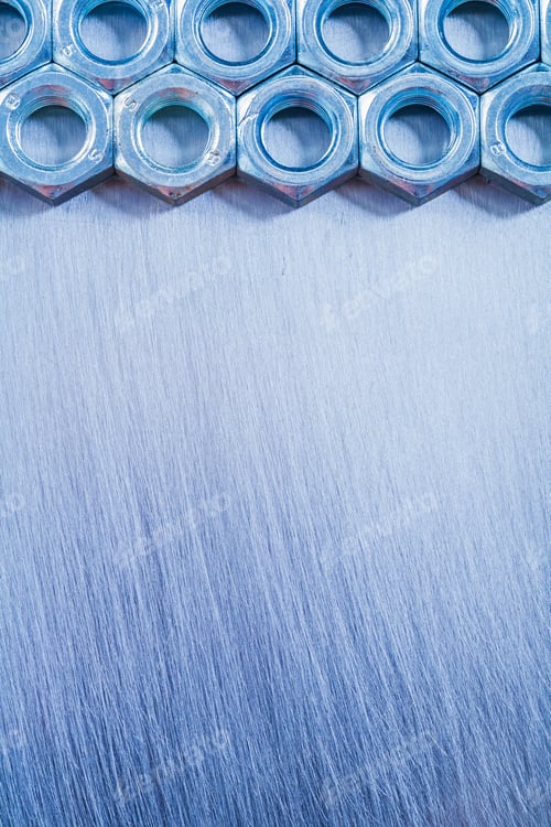 Preview: Vertical Copy Space Image Of Stainless Construction Nuts On Metallic Background Repairing Concept