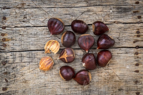 Preview: Fresh Raw Chestnuts On A Wooden Background