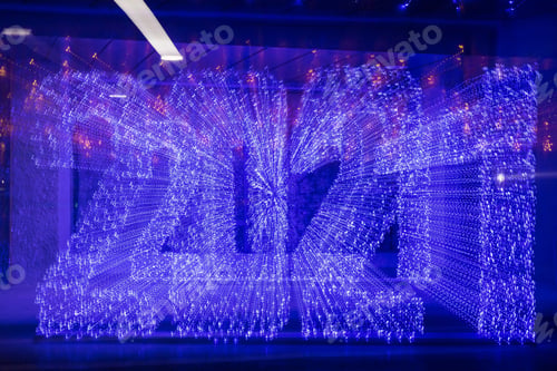 Preview: Lettering of 2021 Made With A Garland. Motion Blur. Zoom Burst Technique. Abstract Background