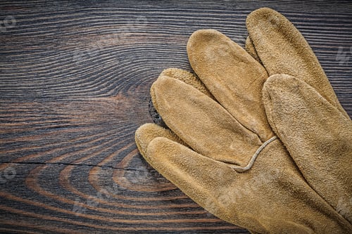 Preview: Pair Of Safety Gloves On Vintage Wooden Board Top View Agriculture Concept.