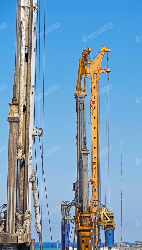 Preview: The Pile Driving Machines On A Background Blue Sky