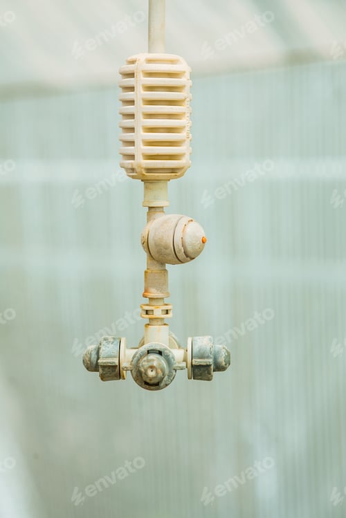 Preview: Agricultural Equipment Water Sprayer In Greenhouse Close Up View