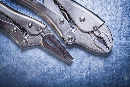 Preview: Lock Jaw Pliers On Metallic Background Construction Concept.