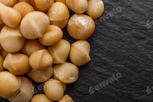 Preview: Delicious Macadamia Nuts On A Dark Stone Background