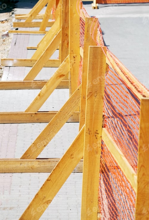 Preview: Orange Grid Of Barrier Tape On Wooden Fence For Construction Site