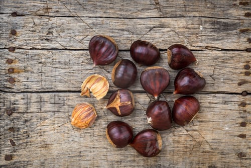 Preview: Fresh Raw Chestnuts On A Wooden Background