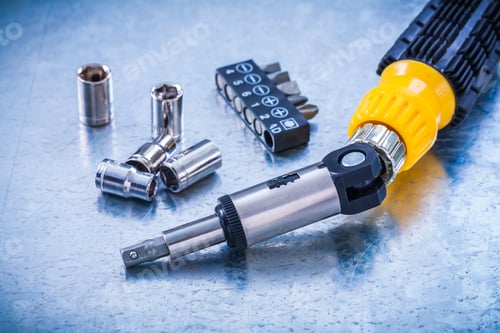 Preview: Horizontal Image Of Reversive Turnscrew Screwdriver Bits And Torx On Metallic Background